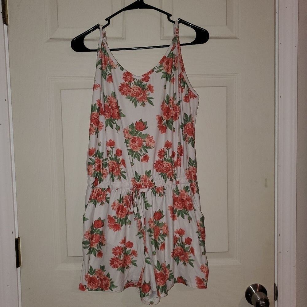 Just be large floral romper with elastic waistband and adjustable straps
